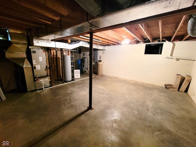 basement with gas water heater and heating unit