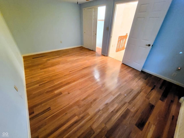 unfurnished room featuring hardwood / wood-style floors