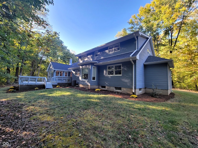 back of house with a wooden deck, a yard, and central air condition unit