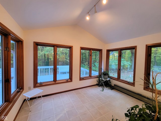 unfurnished sunroom with a wealth of natural light, lofted ceiling, and track lighting