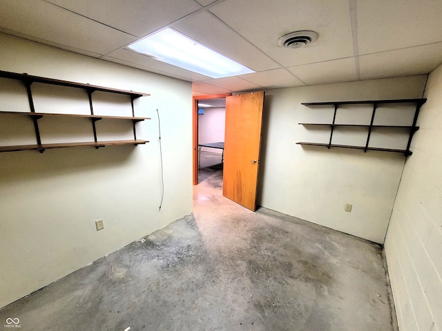 basement featuring a drop ceiling