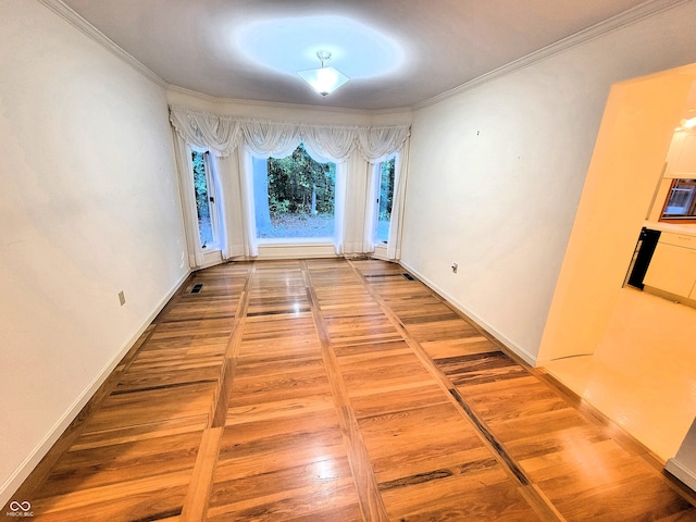 hallway featuring crown molding and wood-type flooring