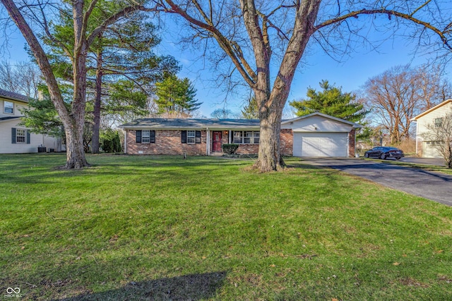 single story home with a front lawn and a garage