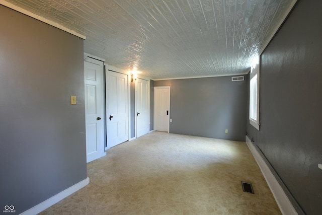 unfurnished room with light colored carpet