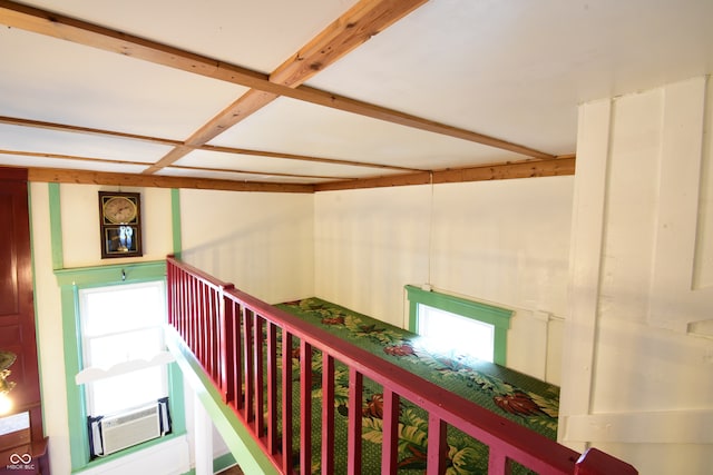 hallway with cooling unit and beamed ceiling