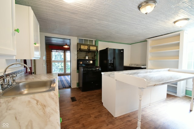 kitchen featuring black appliances, sink, a kitchen bar, white cabinetry, and dark wood-type flooring