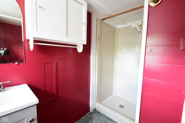 bathroom with vanity and walk in shower