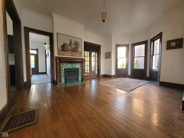 entryway featuring ornamental molding and dark hardwood / wood-style floors