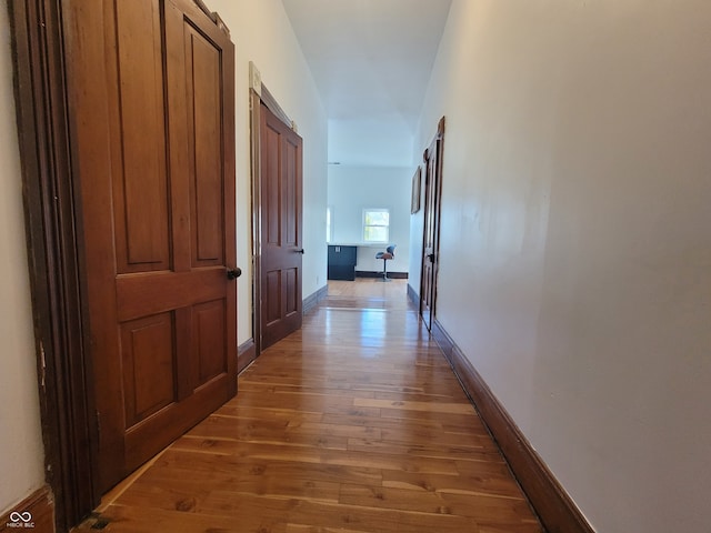 corridor with dark wood-type flooring