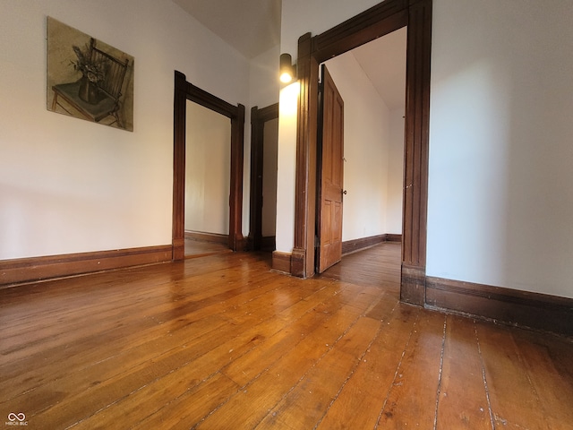 empty room with hardwood / wood-style flooring