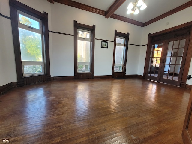 unfurnished room featuring beam ceiling, ornamental molding, a notable chandelier, and dark hardwood / wood-style flooring