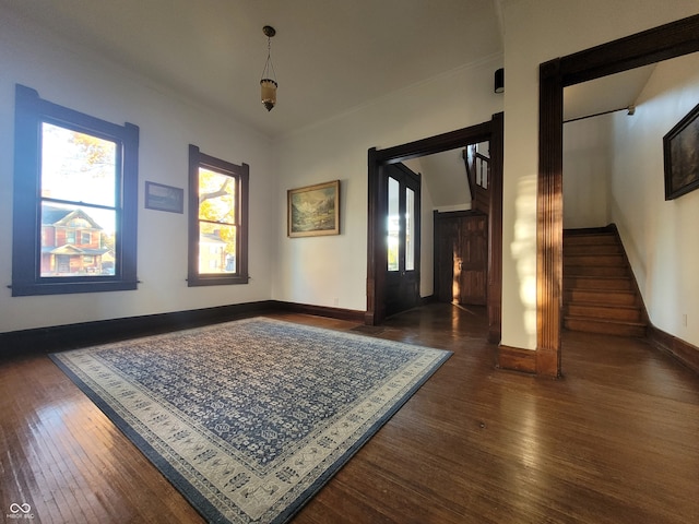 spare room with dark wood-type flooring