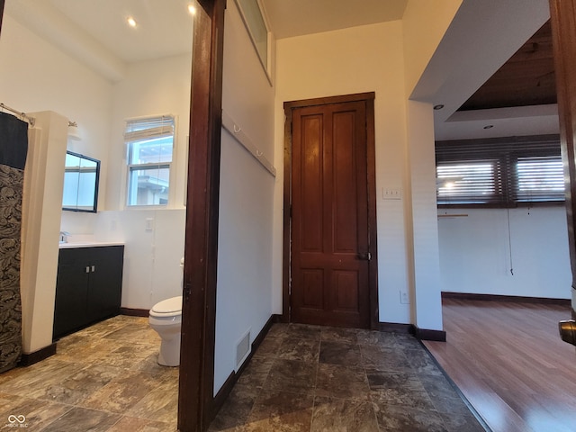 corridor featuring dark wood-type flooring