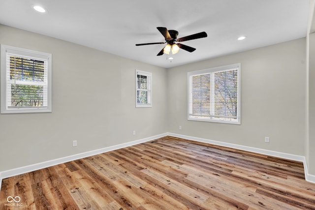 empty room featuring light hardwood / wood-style flooring and ceiling fan