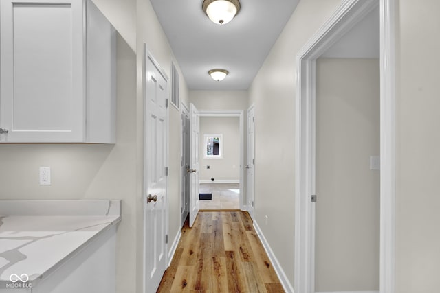 hallway featuring light wood-type flooring