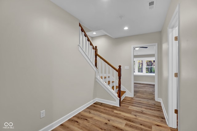 stairway featuring hardwood / wood-style flooring