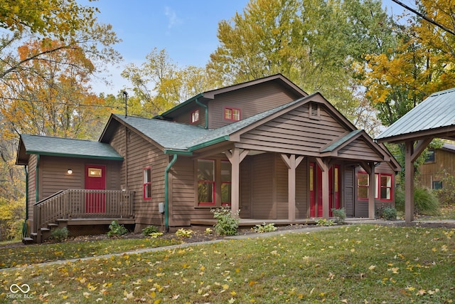 view of front of house featuring a front lawn and covered porch