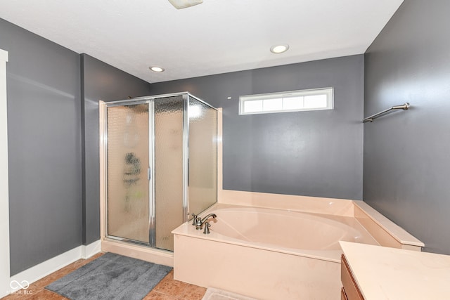 bathroom with vanity, plus walk in shower, and tile patterned flooring