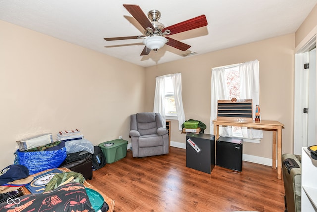 bedroom with dark wood-type flooring and ceiling fan