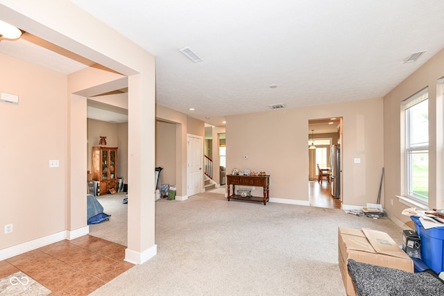 living area with light carpet