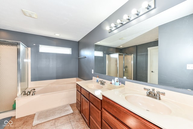 bathroom featuring vanity, shower with separate bathtub, and tile patterned floors