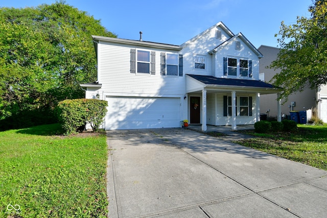 view of front of house with a front yard and a garage