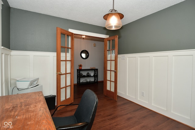 office area with french doors, a textured ceiling, and dark hardwood / wood-style flooring