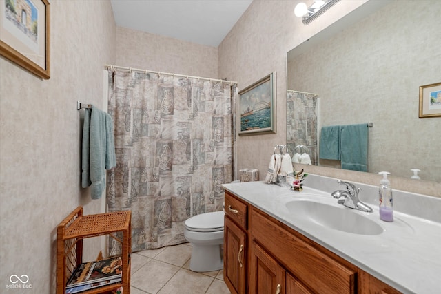 bathroom featuring vanity, toilet, and tile patterned flooring