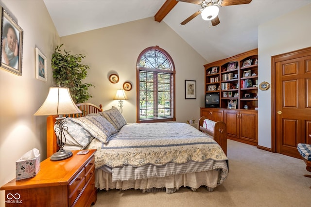 carpeted bedroom with lofted ceiling with beams and ceiling fan