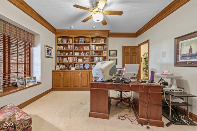 carpeted office with crown molding and ceiling fan