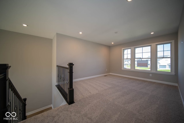 unfurnished living room with light carpet