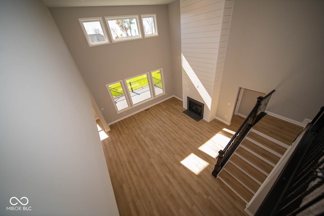 unfurnished living room featuring light hardwood / wood-style floors and a fireplace