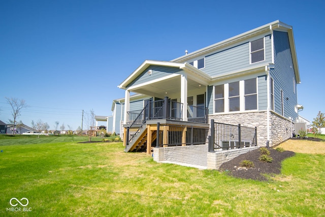 back of house with a lawn