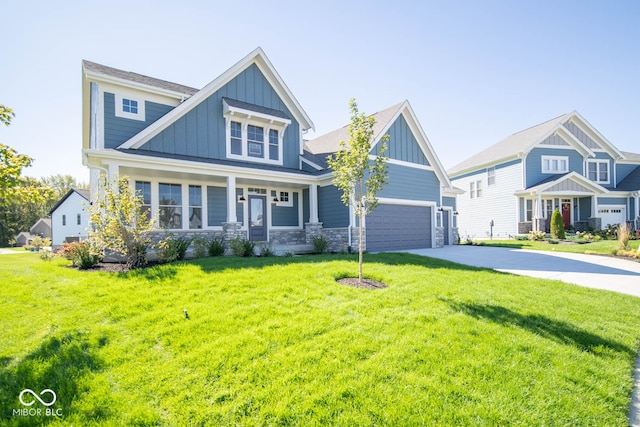 craftsman-style house featuring a front yard and a garage