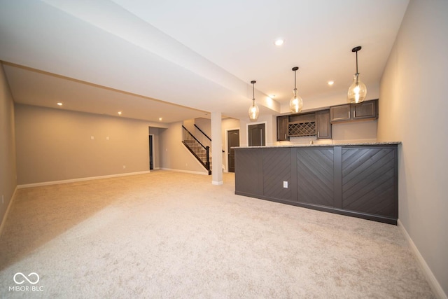 unfurnished living room featuring light carpet