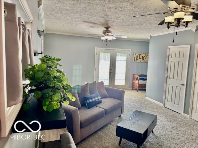 living room featuring french doors, ceiling fan, a textured ceiling, and carpet floors