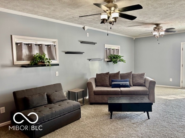 living room featuring crown molding, a textured ceiling, carpet floors, and ceiling fan