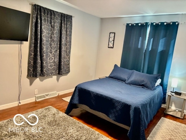 bedroom featuring dark wood-type flooring