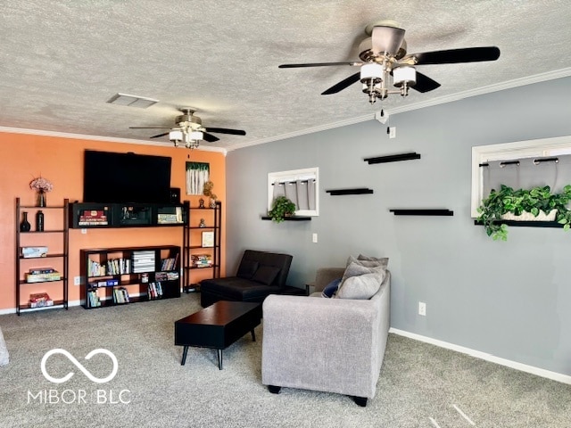 living room with ornamental molding, a textured ceiling, carpet floors, and ceiling fan