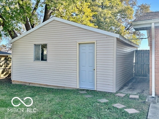 view of outbuilding featuring a lawn