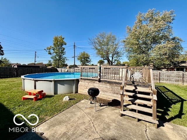 exterior space with a wooden deck and a lawn