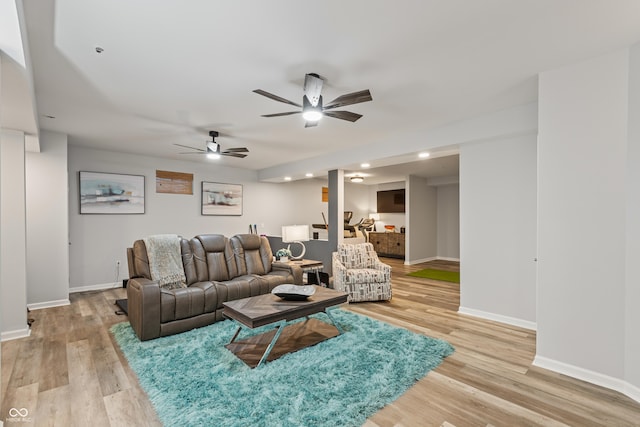 living room with light wood finished floors, baseboards, recessed lighting, and ceiling fan