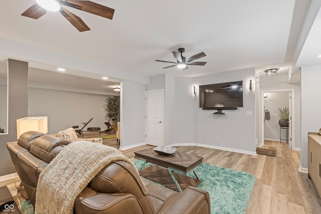 living room with light wood finished floors, baseboards, recessed lighting, and ceiling fan
