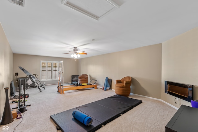 workout room with carpet floors and ceiling fan