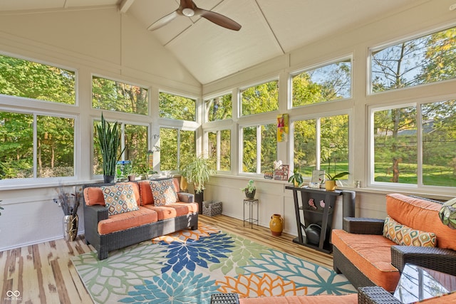 sunroom / solarium with ceiling fan and lofted ceiling