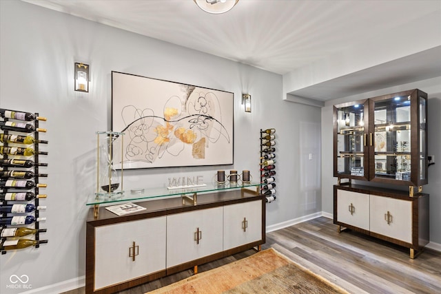 wine cellar featuring wood finished floors and baseboards