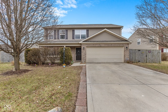 traditional-style home featuring a front yard, concrete driveway, brick siding, and fence