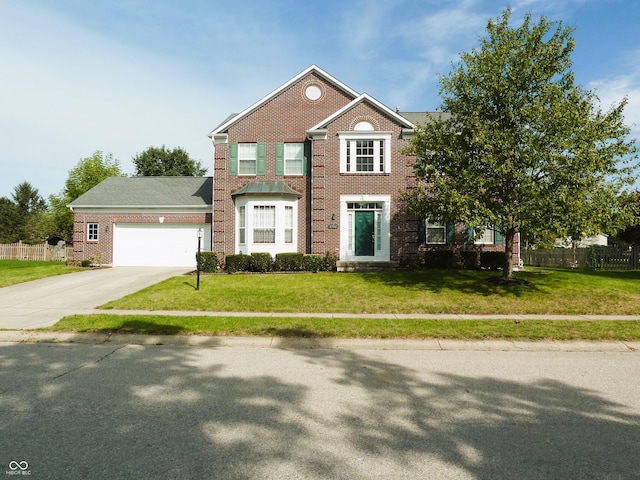 view of front of home featuring a garage and a front lawn