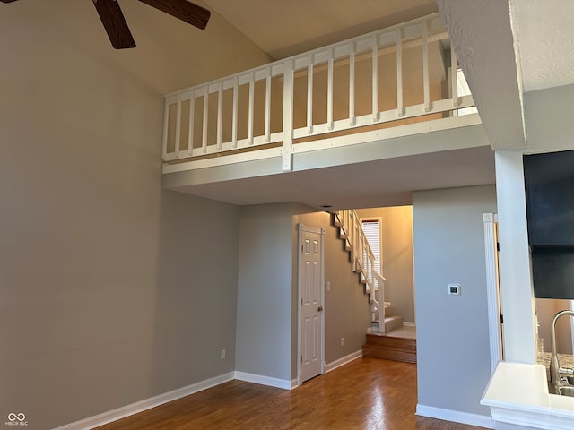 interior space with wood-type flooring, ceiling fan, and sink