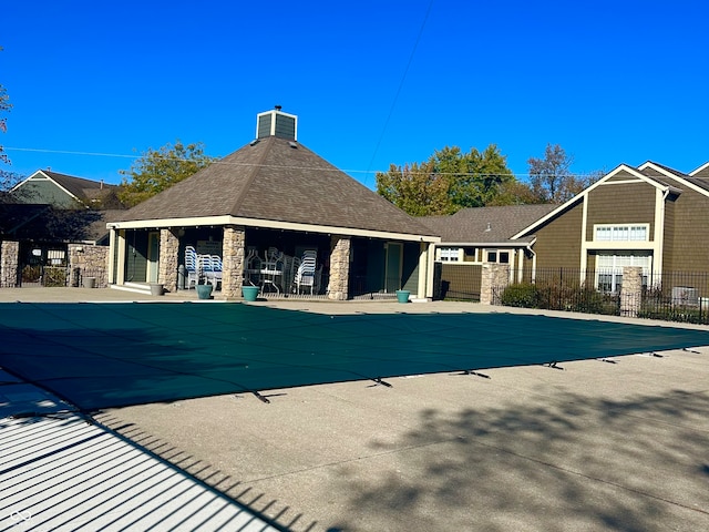 view of pool with a patio and cooling unit